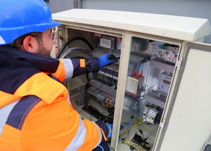 Commercial electricians working on site