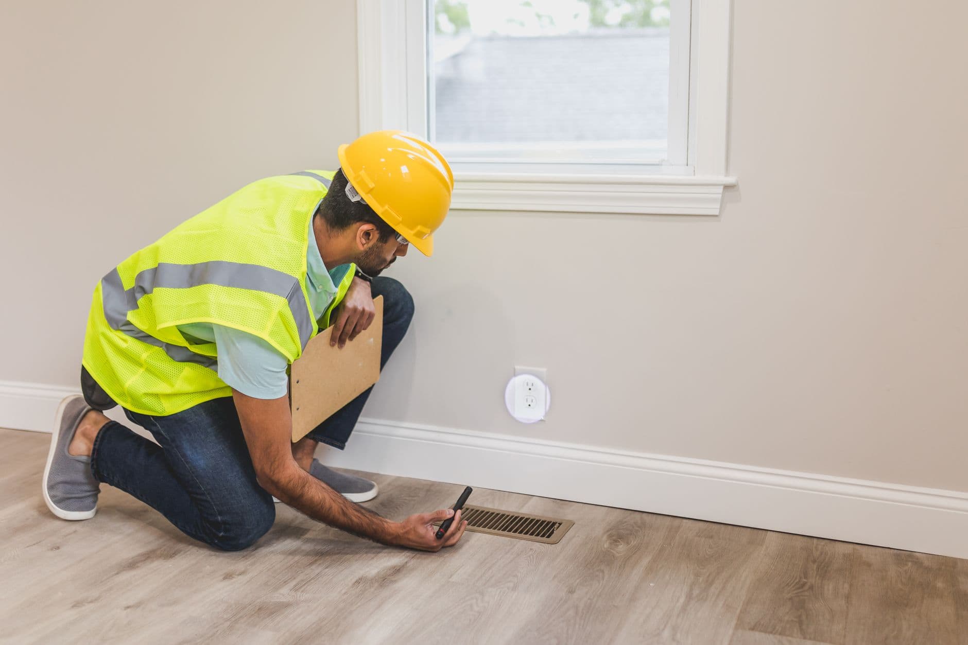 Branch manager walking a warehouse floor plan with a pest control route technician