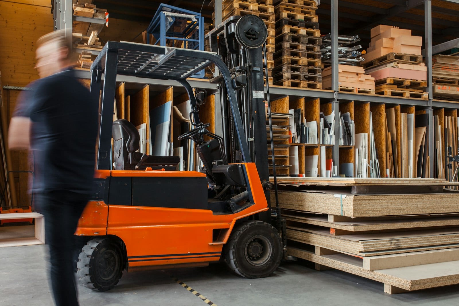 Commercial pest control technician inspecting a warehouse loading dock for pest activity