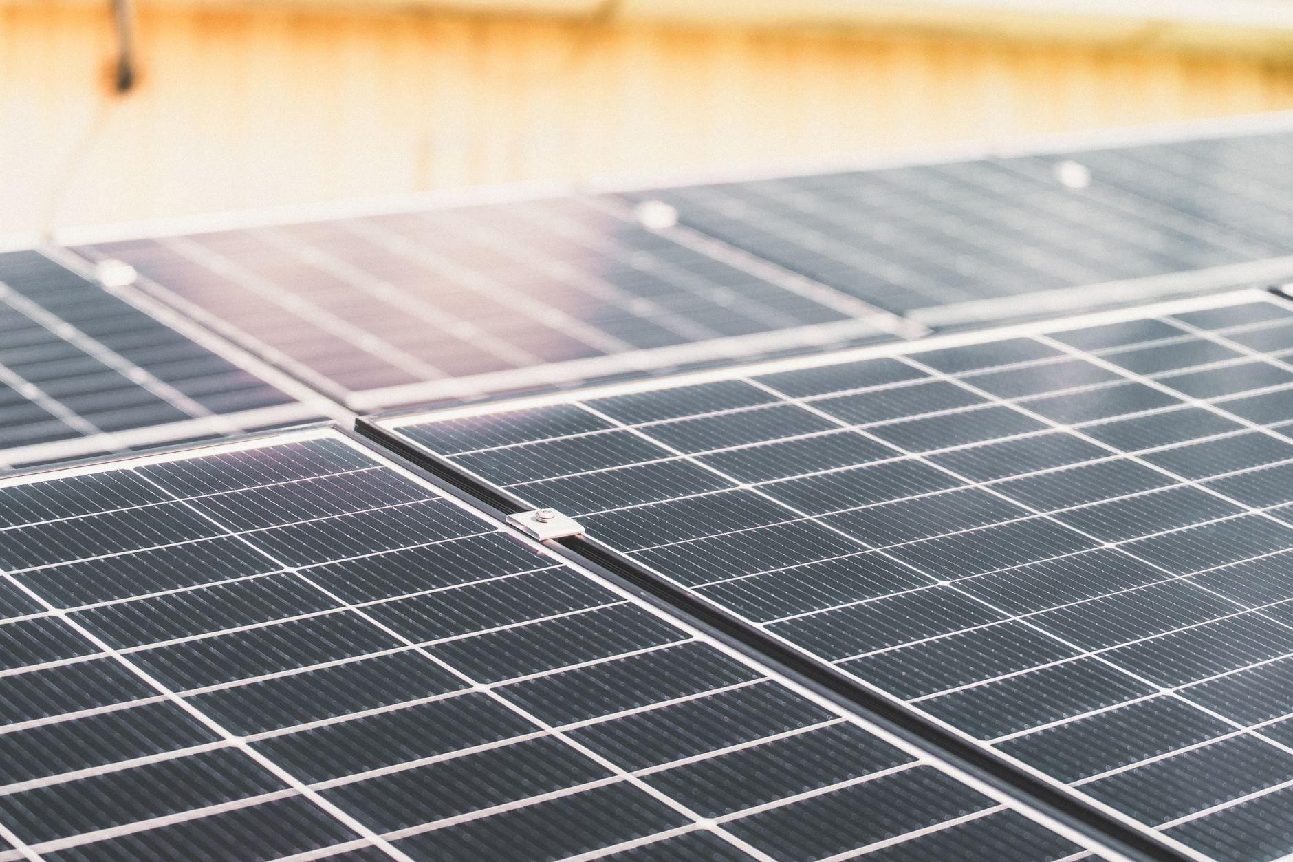 Detailed view of a rooftop solar panel array capturing sunlight for renewable energy production.